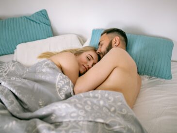 Couple Sleeping Under Blank