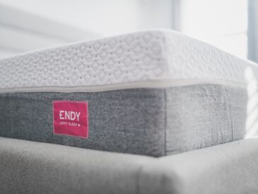 a close up of a mattress with a red label on it